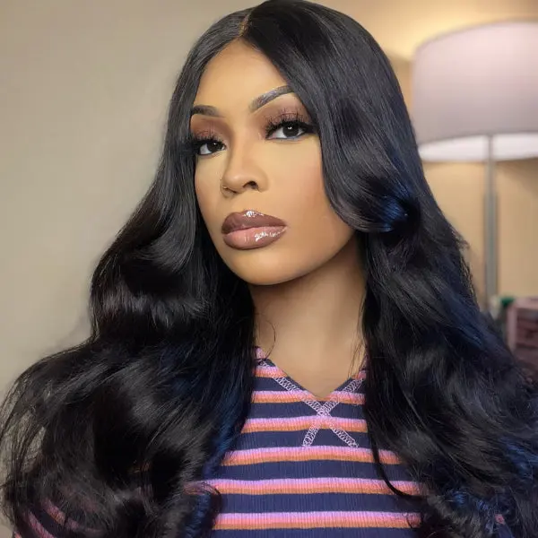 natural black loose wave long wig with minimal HD lace, glueless design, and bangs, styled for a seamless look.