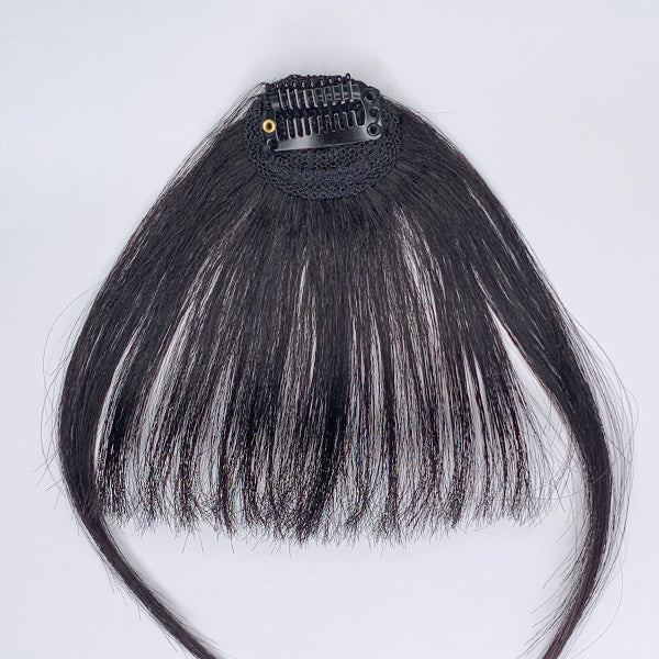 100% human hair clip-in bangs extension showing natural hair texture and seamless clip-in attachment on a model.