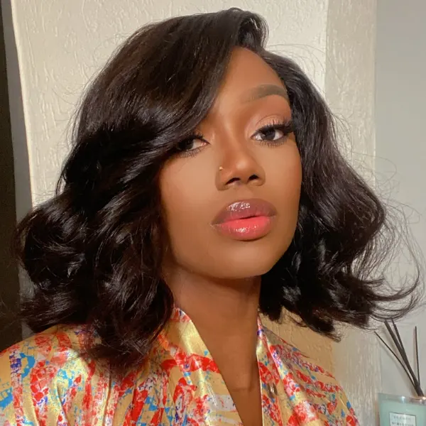 natural black wavy minimalist HD lace glueless C-part short wig made from 100% human hair, showcasing its sleek style.