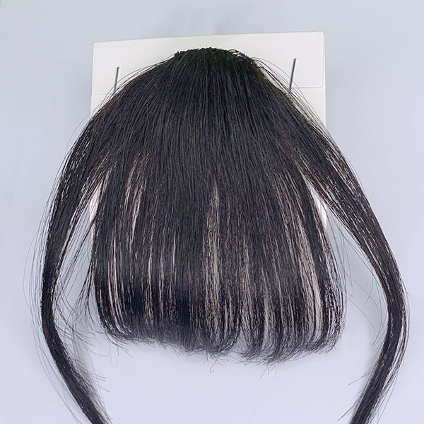 100% real human hair clip-in bangs extension showing natural black hair with a straight style and secure clip attachment.